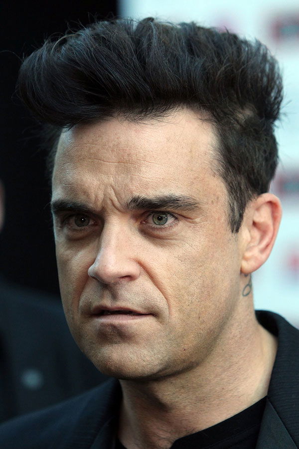 Robbie Williams mit Haar-Tolle